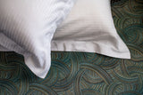 Thomaston Mills Pillow Shams on top of pillows on a bed made with a Thomaston mills duvet cover