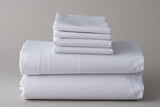 Thomaston T180 New Era Pillowcases folded and stacked on top of Thomaston T180 New Era Sheets.