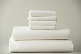 Thomaston Mills T-250 Royal Suite Sheets and Pillowcases folded and stacked.