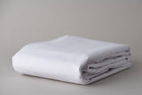 Thomaston Mills white T180 New Era Fitted Sheet folded.