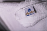 Thomaston Mills White Royal Suite Dobby Towel Label on White Towel.
